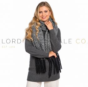 Ladies grey and black knitted scarf with tassels worn by model